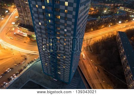 Residential building in Shchukino area and road at night in Moscow, Russia