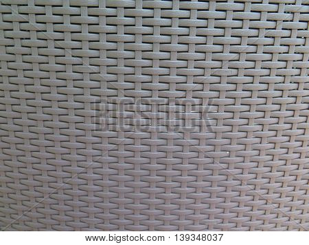 Closeup of Gray Plastic woven chair back