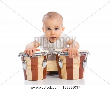 Funny smiling baby with bongos isolated, close up