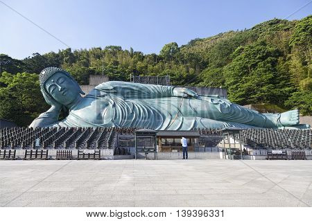 The bronze statue of reclining Buddha state at Nanzoin Temple in Sasaguri, Fukuoka, Japan.This is the bigest lying statue in the world.