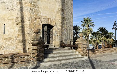 Detail of the small entry door to the Torre del Oro (Tower of the Gold) a dodecagonal military watchtower in Seville Spain.