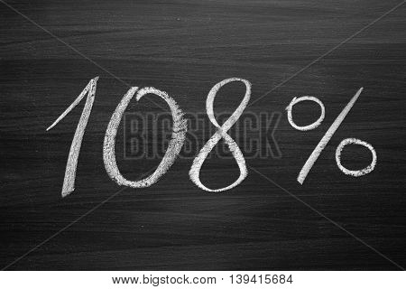 108 percent header written with a chalk on the blackboard