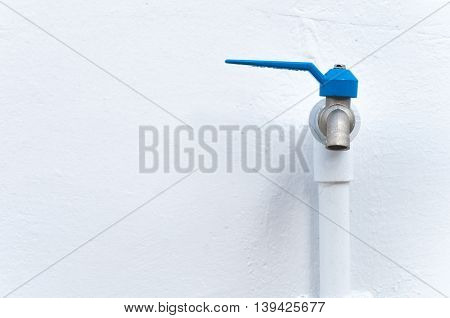 Tap closeup with dripping water-drop. Water leaking saving concept.