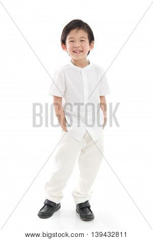Happy little asian boy in white cothes on white background isolated
