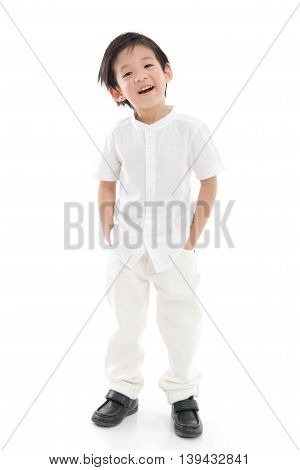 Happy little asian boy in white cothes on white background isolated