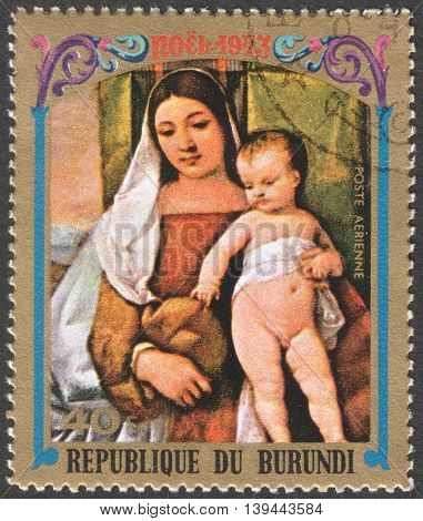 MOSCOW RUSSIA - CIRCA JANUARY 2016: a stamp printed in BURUNDIA shows painting "The Virgin and Child" by Titian the series "Christmas - Various Paintings of "The Virgin and Child" circa 1973