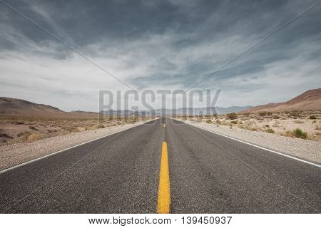 panoramic view of nice road coming through the deatn valley
