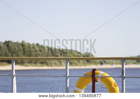 lifebuoy hanging on a background of the river