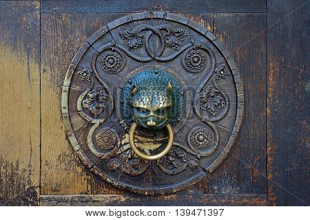 Augsburg, Germany, July 5, 2016: The door handle of the main door at the cathedral in Augsburg, Germany.