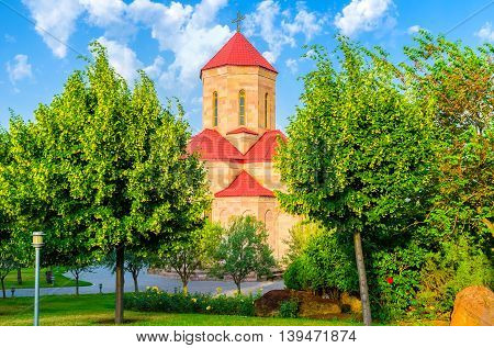 The Chapel surrounded by lush garden located adjacent to the Holy Trinity (Sameba) Cathedral of Tbilisi Georgia.