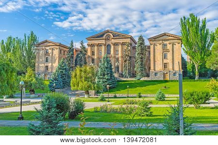 The building of National Assembly of Armenia (Parliament) surrounded by large garden Yerevan Armenia.