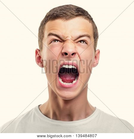 Portrait of young angry man. Toned photo.
