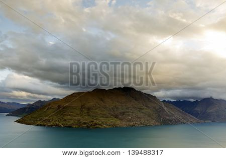 The incoming storm with thick cloud formation passing over the mountains.
