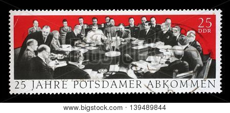 ZAGREB, CROATIA - JULY 03: A stamp printed in GDR dedicate 25th anniv. of the Potsdam Agreement, Churchill, Harry S. Truman and Stalin, circa 1970, on July 03, 2014, Zagreb, Croatia