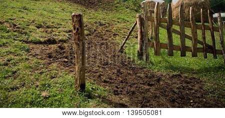 Sheepfold made of wood and barbed wire