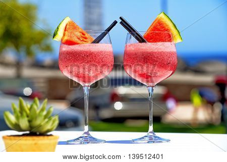 refreshing fruit cockail with watermelon in big glasses for summer parties