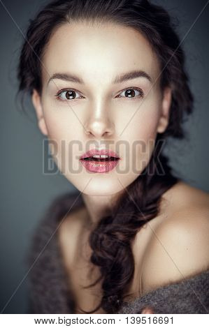 Fashion portrait of gorgeous young brunetee woman.Flirt expression. Shallow depth of field