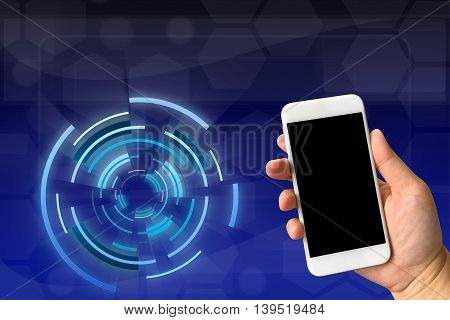 Woman hand holding smartphone against digital blue background with copy space