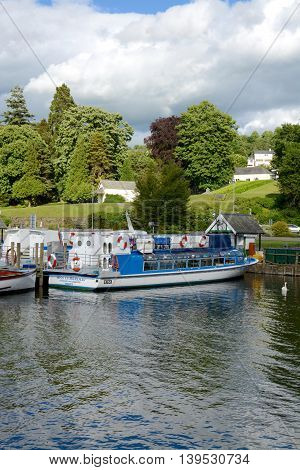 BOWNESS ON WINDERMERE, UK - JUNE 20, 2016: Pleasure cruise boats at the pier, Bowness on Windermere, Cumbria, UK