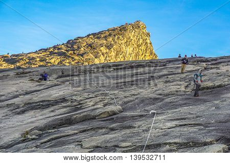 Ranau,Sabah,Borneo-March 13,2016:Group of climber move down from Low's Peak to Laban Rata at Mountain Kinabalu.There are two summit trails completed as of 18 May 2016,Ranau Trail & Kota Belud Trail.
