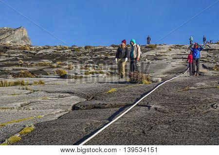 Ranau,Sabah,Borneo-March 13,2016:Group of climbers moving down to Laban Rata after succesfully completed conquering the summit of mountain Kinabalu.