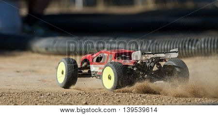 BOISE IDAHO-JULY 16 2016: Truggy kicking up dirt in the turn at the Boise Summer Blast points race.