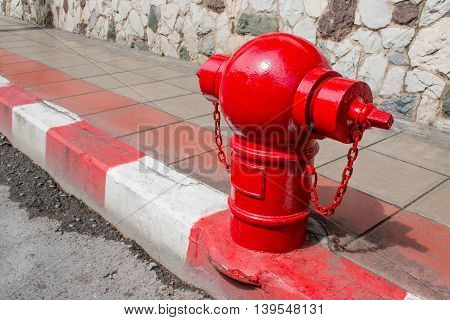 Asian Fire Hydrant On Street. Typical Red Fire Hydrant Asian On Street. Red Fire Hydrant Vintage Sty