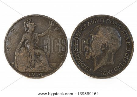 Close up shot of an Old English Penny Coin, head and tail side