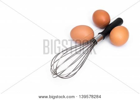 Hen eggs and eggbeater on white background