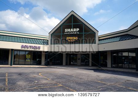 SHOREWOOD, ILLINOIS / UNITED STATES - AUGUST 30, 2015: One may buy or sell real estate with the assistance of realtors at Sharp Homes Spring Realty, in a Shorewood strip mall.