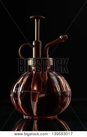 vintage perfume bottle with a dark background