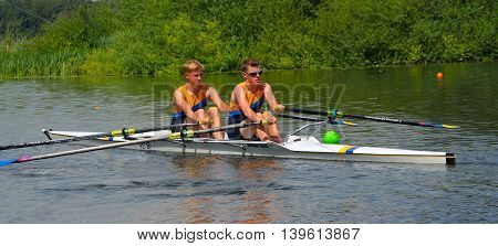 St Neots, Cambridgeshire, England - July 23, 2016: Young men in Pairs Sculling on the river Ouse at St Neots.