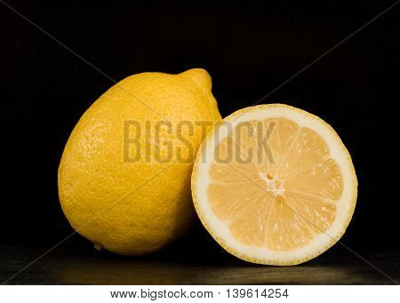 Ripe two lemons on a black background