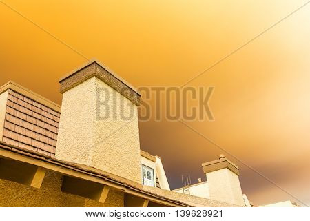 Wildfire orange smoke passing over residence in the city