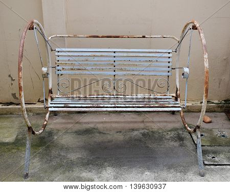 The old swing in playground. Dirty area.