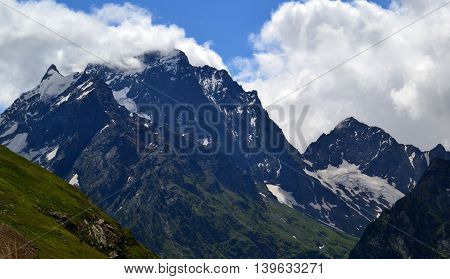 Mountain peaks of Dombay in the clouds. The Republic of Karachay-Cherkessia in the North Caucasus Russia. Photo taken on: July 26 Friday 2013
