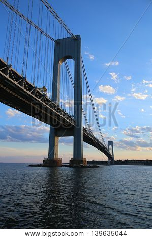 NEW YORK - JULY 23, 2016: Verrazano Bridge at dusk in New York.The Verrazano Bridge is a double-decked suspension bridge that connects the boroughs of Staten Island and Brooklyn