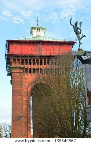 COLCHESTER ESSEX ENGLAND 8 March 2015: Colchester jumbo water tower with Mercury figure in foreground