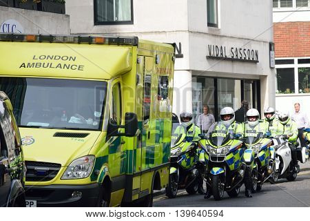 CITY OF LONDON ENGLAND 13 March 2015: Police Motorcyclists and Ambulance