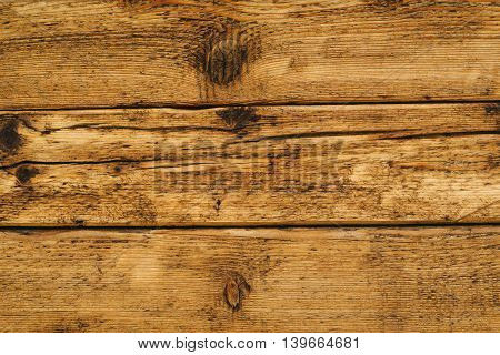 Wet wooden floor board surface of solid rustic wood planks