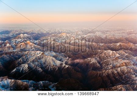 Beautiful View From The Aircraft To The Mountains In Tashkent, China And Kirgistan, Covered With Sno