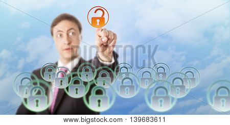 Manager is looking at a virtual padlock he is opening by touch in midair. Concept for data security access control cloud computing information technology governance and data resource management.