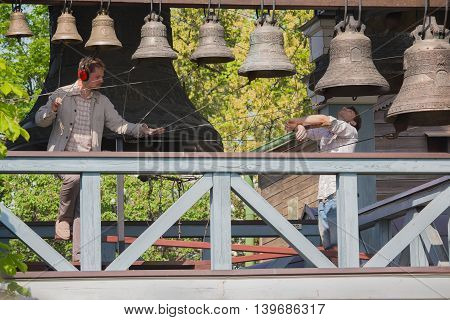 Kiev Ukraine - May 05 2016: Bell-ringers play on the set of bells of Holy Trinity Monastery of St. Jonas