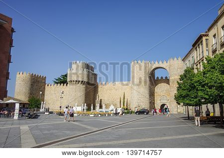 Avilaб Spain - August 23 2012: Gate Puerta del Alcazar of the medieval walls of Avila. View from Plaza Santa Teresa de Jesus. Castilla y Leon Spain Europe