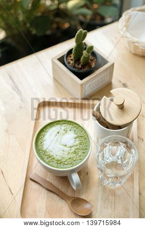 Hot Green Tea Set On A Wooden Table In A Coffeshop