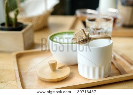 Hot Green Tea Set On A Wooden Table In A Coffeshop