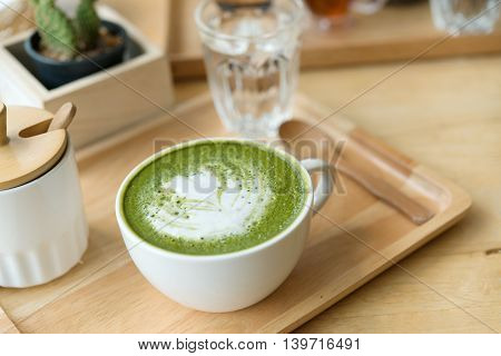 Hot Green Tea Set On A Wooden Table In A Coffeshop
