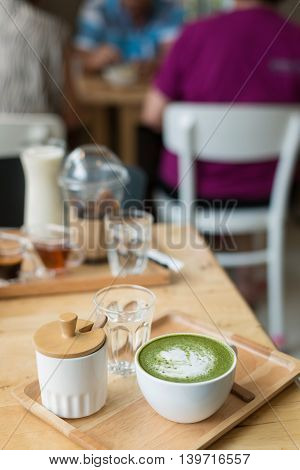 Hot Green Tea Set On A Wooden Table In A Coffeshop