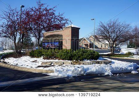 JOLIET, ILLINOIS / UNITED STATES - NOVEMBER 24, 2015: A sign, outside the Wesmere Country Club Clubhouse, welcomes people to the Wesmere Country Club in Joliet.