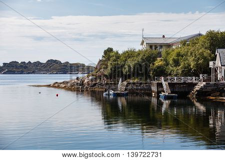 Beautiful view on nowegian fjords and seaside houses. Tranquil scene.